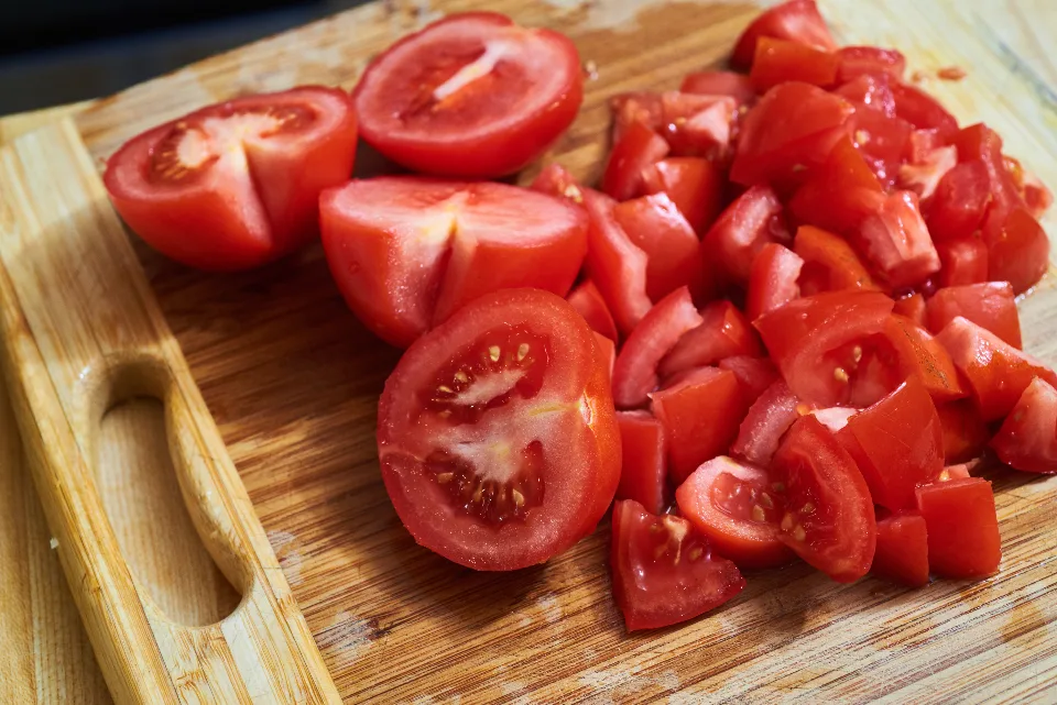 Freshly chopped tomatoes on a cutting board